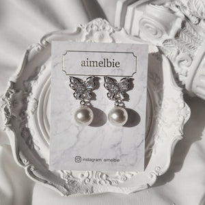 Butterfly and pearl earrings